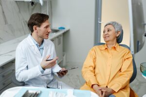 Dentist with senior woman